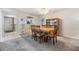 Dining room with wooden table and matching chairs under a ceiling fan at 3055 Casa Del Sol Cir # 202, Clearwater, FL 33761