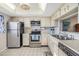 Bright kitchen featuring stainless steel appliances and white cabinetry at 3055 Casa Del Sol Cir # 202, Clearwater, FL 33761