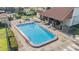 Community pool and patio with outdoor seating for residents to enjoy at 3055 Casa Del Sol Cir # 202, Clearwater, FL 33761