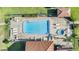 Aerial view of the sparkling community pool and jacuzzi with lounge seating and a covered patio at 3055 Casa Del Sol Cir # 202, Clearwater, FL 33761