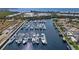 Aerial view of the marina in Little Harbor with yachts and waterfront residences at 3125 Christophers Watch Ln, Ruskin, FL 33570
