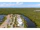 Breathtaking aerial view of waterfront homes with private docks and lush green foliage at 3125 Christophers Watch Ln, Ruskin, FL 33570