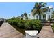 Home's backyard with dock, lush landscaping, and inviting outdoor space at 3125 Christophers Watch Ln, Ruskin, FL 33570