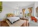 Serene bedroom with a ceiling fan, balcony access, and views, offering a comfortable and private retreat at 3125 Christophers Watch Ln, Ruskin, FL 33570