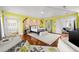 Expansive primary bedroom featuring hardwood floors, stone accent wall, and vaulted ceilings at 3125 Christophers Watch Ln, Ruskin, FL 33570