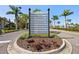 Little Harbor entrance sign amid lush landscaping directing to marina, inn, restaurant, and more at 3125 Christophers Watch Ln, Ruskin, FL 33570