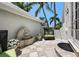 Charming courtyard with a decorative fountain, potted flowers, and comfortable outdoor seating at 3125 Christophers Watch Ln, Ruskin, FL 33570