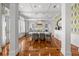 Open-concept dining space connects to the kitchen and features stylish wallpaper accent at 3125 Christophers Watch Ln, Ruskin, FL 33570
