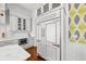 Gourmet kitchen featuring custom cabinets, marble countertops, and high-end stainless steel appliances at 3125 Christophers Watch Ln, Ruskin, FL 33570