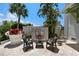 Elegant outdoor fireplace with comfortable seating, perfect for entertaining and relaxation under the stars at 3125 Christophers Watch Ln, Ruskin, FL 33570