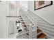 Staircase with wood steps, white railings and a high ceiling at 3125 Christophers Watch Ln, Ruskin, FL 33570