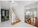 Bright staircase with wooden steps leading to a spacious living area at 3125 Christophers Watch Ln, Ruskin, FL 33570