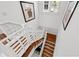 Unique staircase with hardwood steps, decorative railings, and bright natural light for a welcoming entrance at 3125 Christophers Watch Ln, Ruskin, FL 33570