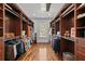 Spacious walk-in closet with custom shelving and ample storage space at 3125 Christophers Watch Ln, Ruskin, FL 33570
