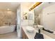 Modern bathroom featuring a soaking tub, vessel sink, and stylish fixtures at 31645 Bugle Ln, Wesley Chapel, FL 33543