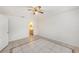 Bedroom with a bathroom, featuring tile floors at 31645 Bugle Ln, Wesley Chapel, FL 33543