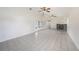 Expansive living room with tile flooring, fireplace, and glass doors leading to the outdoors at 31645 Bugle Ln, Wesley Chapel, FL 33543