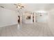 Expansive living room with tile flooring, open layout, and a clear view of the front door at 31645 Bugle Ln, Wesley Chapel, FL 33543
