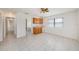 Bright room with neutral walls, tile floors, and built in kitchen counter at 31645 Bugle Ln, Wesley Chapel, FL 33543