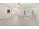 Bright and spacious living room features tile flooring and glass patio doors at 31645 Bugle Ln, Wesley Chapel, FL 33543