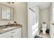 Bright bathroom featuring a walk-in shower, marble countertop, and neutral color palette at 340 6Th E St, Bradenton, FL 34208