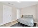 Simple bedroom featuring minimal decor and comfortable queen-sized bed at 340 6Th E St, Bradenton, FL 34208