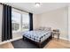 Cozy bedroom with a large window, modern decor, and neutral tones at 340 6Th E St, Bradenton, FL 34208