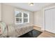 Bright bedroom offering two windows and a comfortable bed at 340 6Th E St, Bradenton, FL 34208