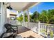 Cozy porch features comfortable seating, offering a relaxing outdoor space with views of a tropical street at 340 6Th E St, Bradenton, FL 34208