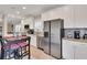 Modern kitchen features stainless steel appliances, granite countertops, and a breakfast bar for convenience at 340 6Th E St, Bradenton, FL 34208