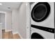 Hallway featuring a stacked washer and dryer laundry unit at 340 6Th E St, Bradenton, FL 34208