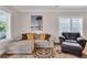 Comfortable living room showcasing neutral tones, a decorative rug and natural light at 340 6Th E St, Bradenton, FL 34208