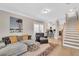 Open living area showcasing hardwood floors and seamless flow into the modern kitchen at 340 6Th E St, Bradenton, FL 34208