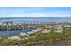 Scenic aerial view of a waterfront community with lush surroundings and waterway access at 340 Sapphire Lake Dr # 202, Bradenton, FL 34209