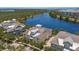 The yellow townhome is near the lake and woods in this aerial view at 340 Sapphire Lake Dr # 202, Bradenton, FL 34209