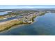 Aerial view showcases the waterfront community and neighborhood near the bay at 340 Sapphire Lake Dr # 202, Bradenton, FL 34209