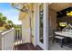 Balcony area with exterior view of the home and surrounding tropical landscape at 340 Sapphire Lake Dr # 202, Bradenton, FL 34209