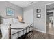 Well-lit bedroom featuring hardwood floors, gray walls, a closet and a doorway leading out at 340 Sapphire Lake Dr # 202, Bradenton, FL 34209