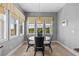 Bright breakfast nook with views of tropical foliage and a glimpse of the neighboring building at 340 Sapphire Lake Dr # 202, Bradenton, FL 34209