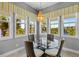 Cozy breakfast nook surrounded by windows with beautiful views of the waterfront at 340 Sapphire Lake Dr # 202, Bradenton, FL 34209