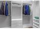 Walk-in closet provides shelving and drawers for folded clothes at 340 Sapphire Lake Dr # 202, Bradenton, FL 34209