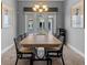 Formal dining room with seating for eight, artwork, and modern lighting at 340 Sapphire Lake Dr # 202, Bradenton, FL 34209