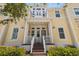 Charming yellow townhome with inviting front porch and well-maintained landscaping at 340 Sapphire Lake Dr # 202, Bradenton, FL 34209