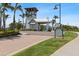 The Harbour Isle community guardhouse features lush landscaping and a charming lighthouse at 340 Sapphire Lake Dr # 202, Bradenton, FL 34209