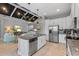 Open kitchen with island, stainless steel appliances, and view into living space at 340 Sapphire Lake Dr # 202, Bradenton, FL 34209