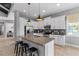 Modern kitchen with island, stainless steel appliances, and ample cabinet space at 340 Sapphire Lake Dr # 202, Bradenton, FL 34209