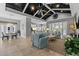 Bright living room with two ceiling fans, tiled floors, and comfortable seating at 340 Sapphire Lake Dr # 202, Bradenton, FL 34209