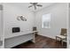 Home office with hardwood floors, a large window, and a modern desk at 340 Sapphire Lake Dr # 202, Bradenton, FL 34209