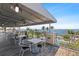 Outdoor dining area with tables and chairs offers relaxing views of the water at 340 Sapphire Lake Dr # 202, Bradenton, FL 34209