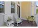 Charming porch with rocking chairs and table, great for relaxing at 340 Sapphire Lake Dr # 202, Bradenton, FL 34209